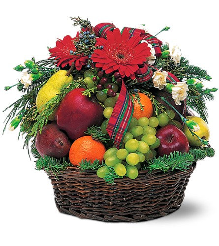 Cesta de frutas y flores para invierno y Navidad.